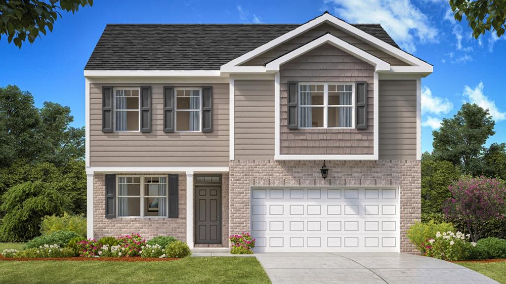 a front view of a house with a yard and garage