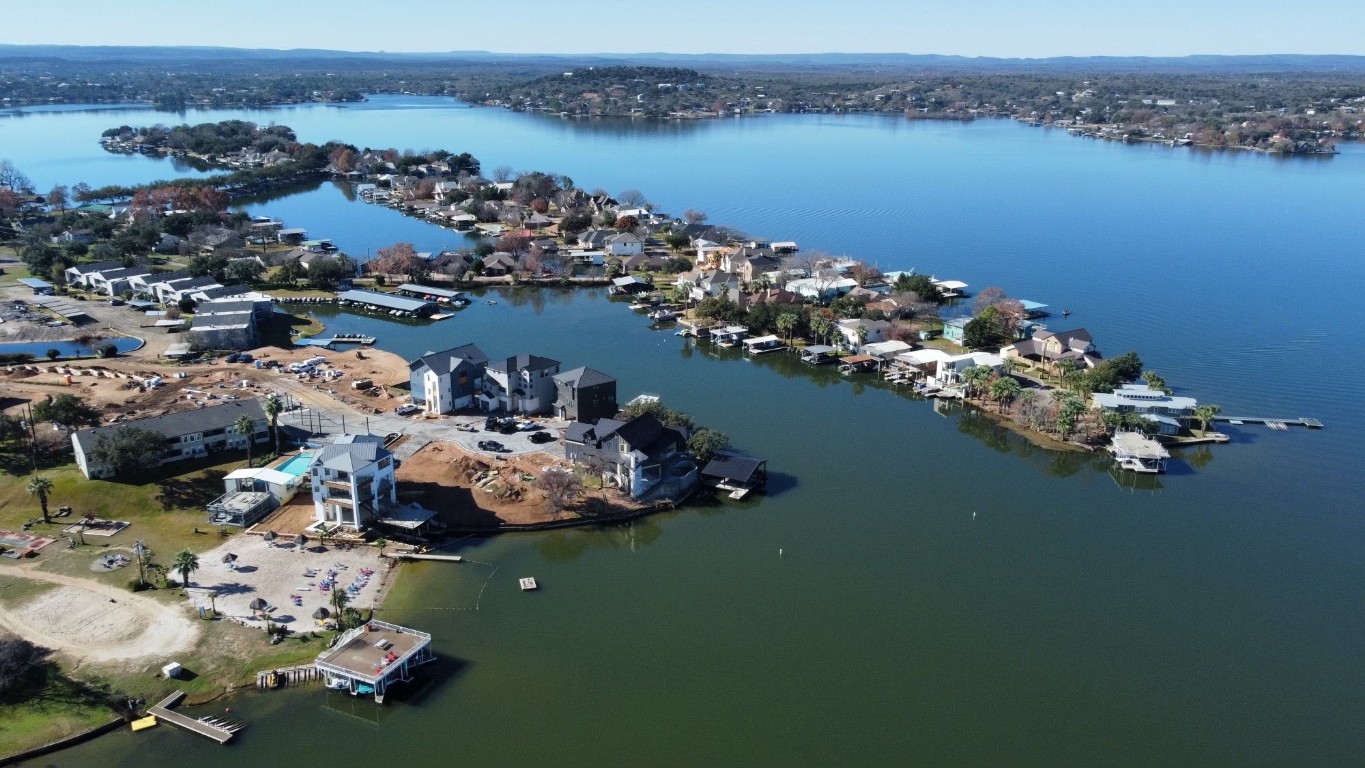 an aerial view of a house with ocean view