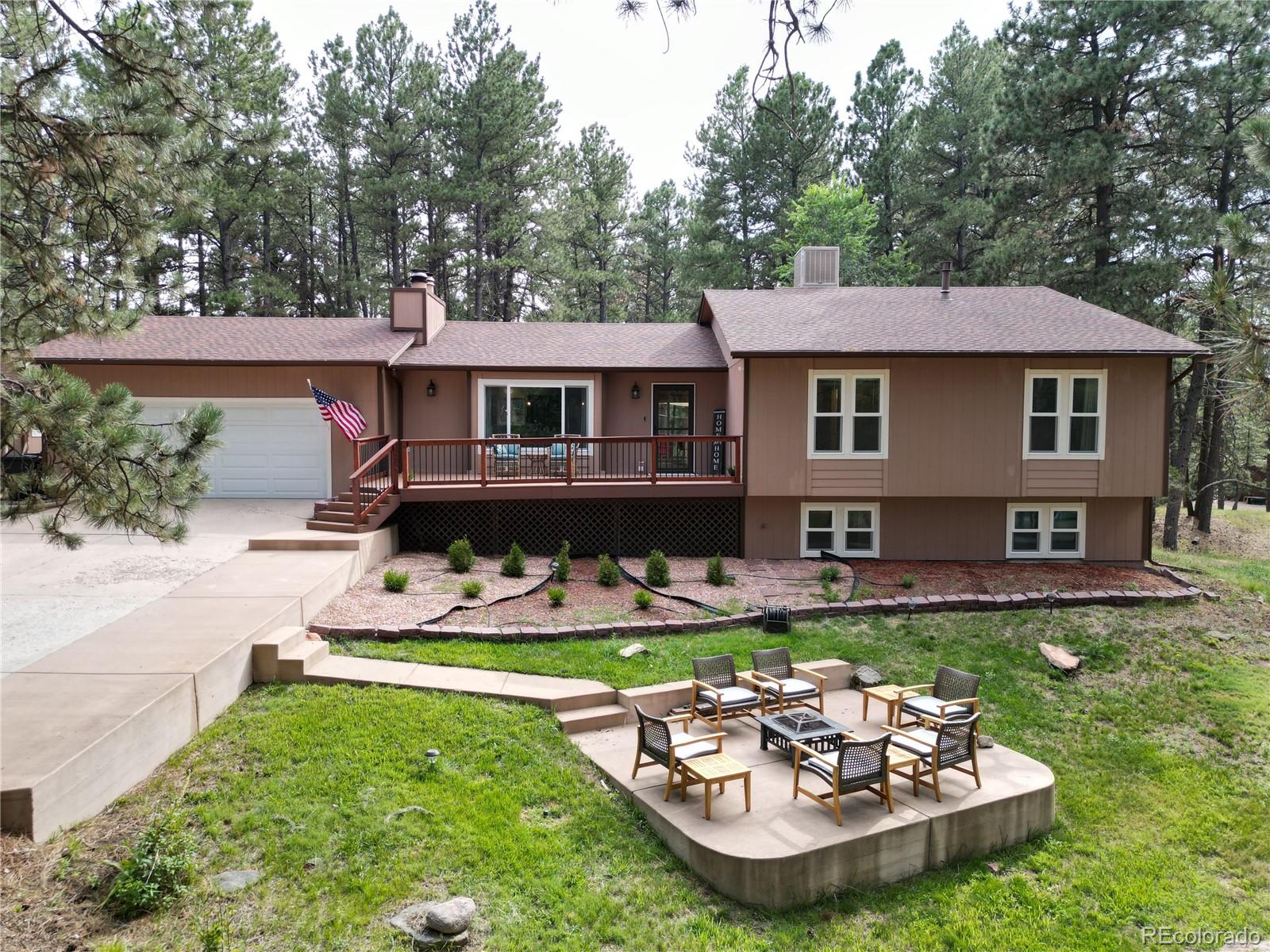 a view of a house with pool table and chairs