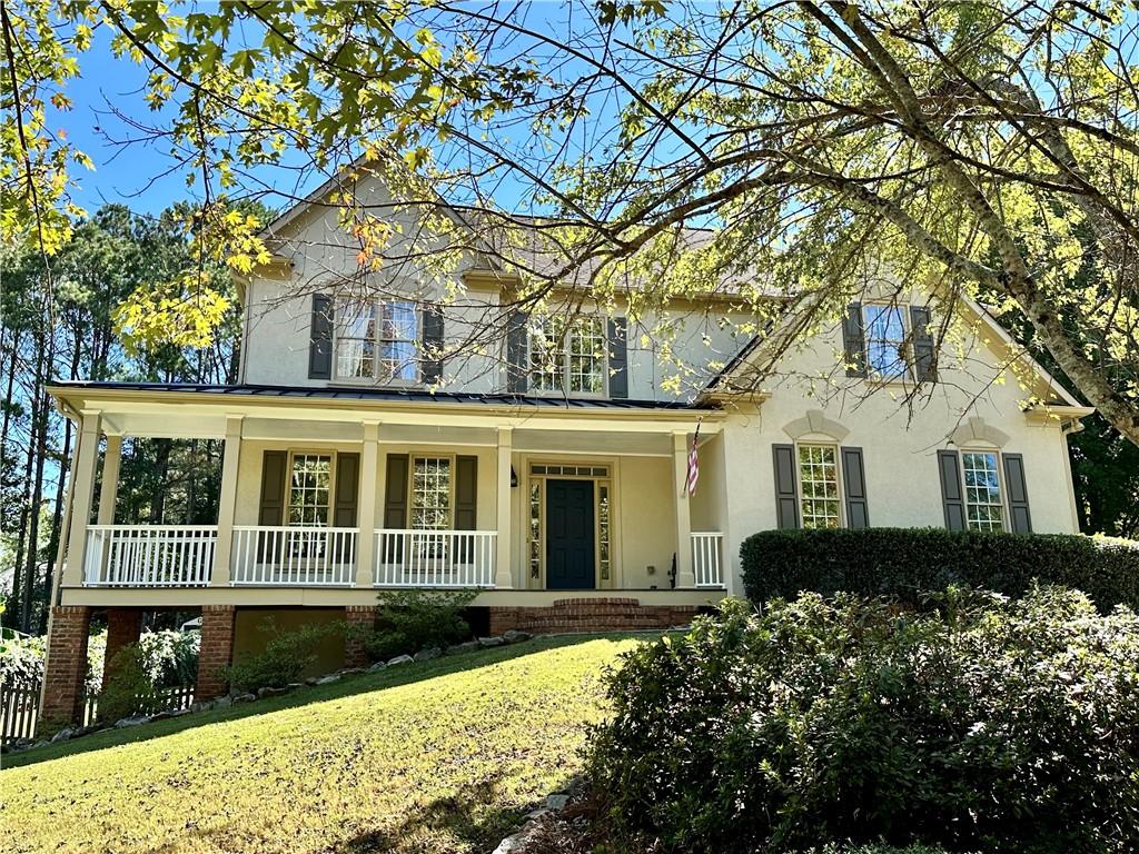 front view of a house with a yard