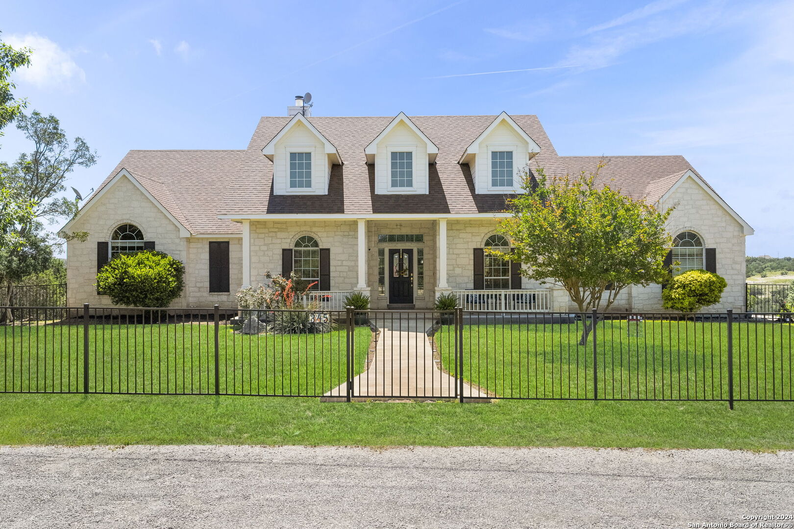 a view of a garden in front of a house