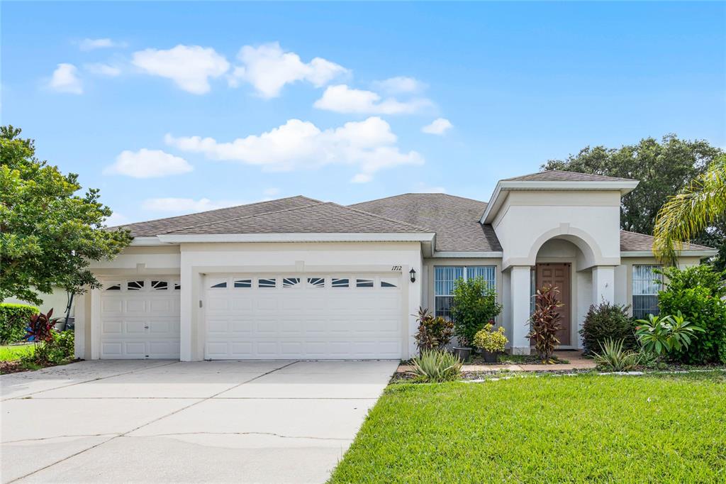 front view of a house with a yard