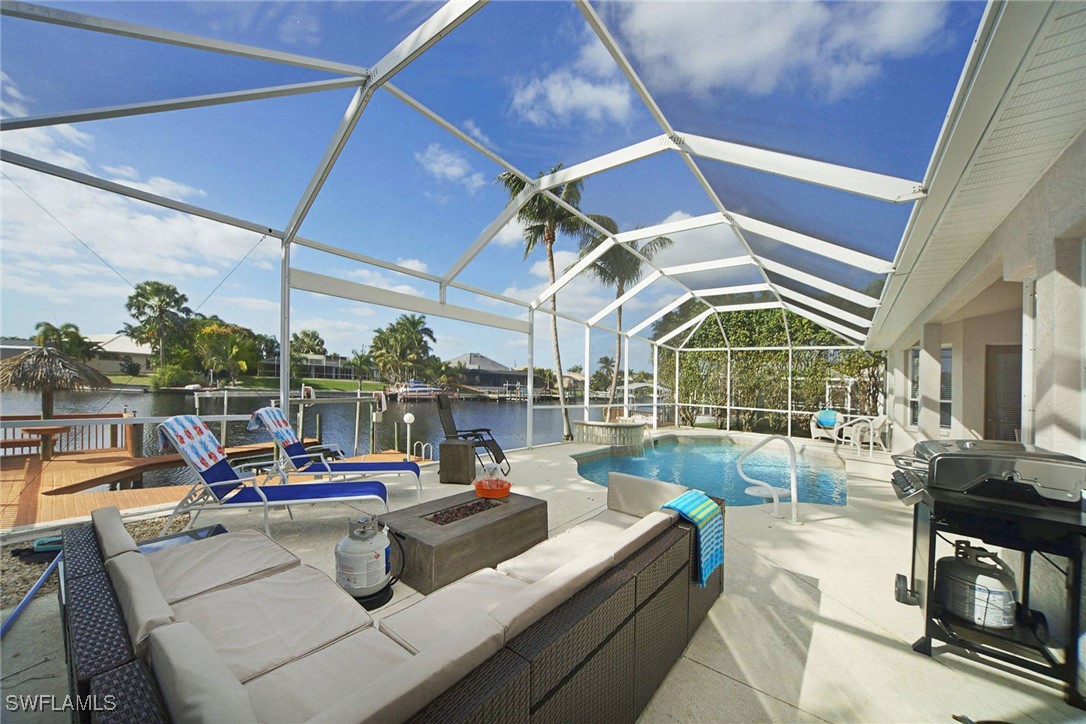 a view of a patio with couches and pool