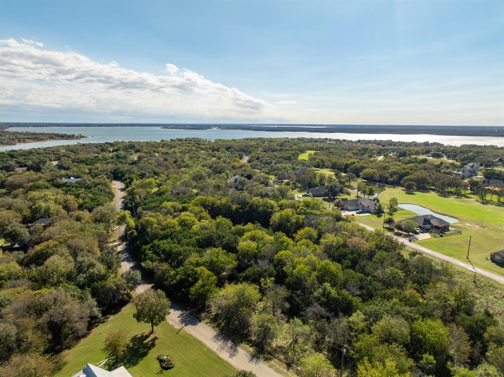 an aerial view of residential houses with city view