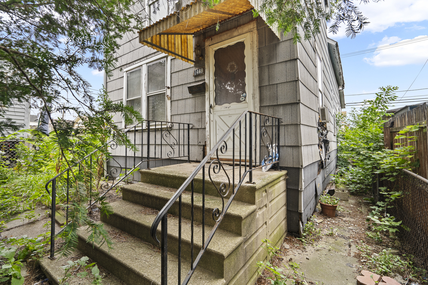 front view of a house with a yard