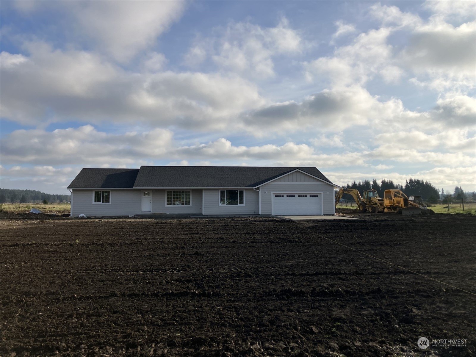 a view of a house next to a yard