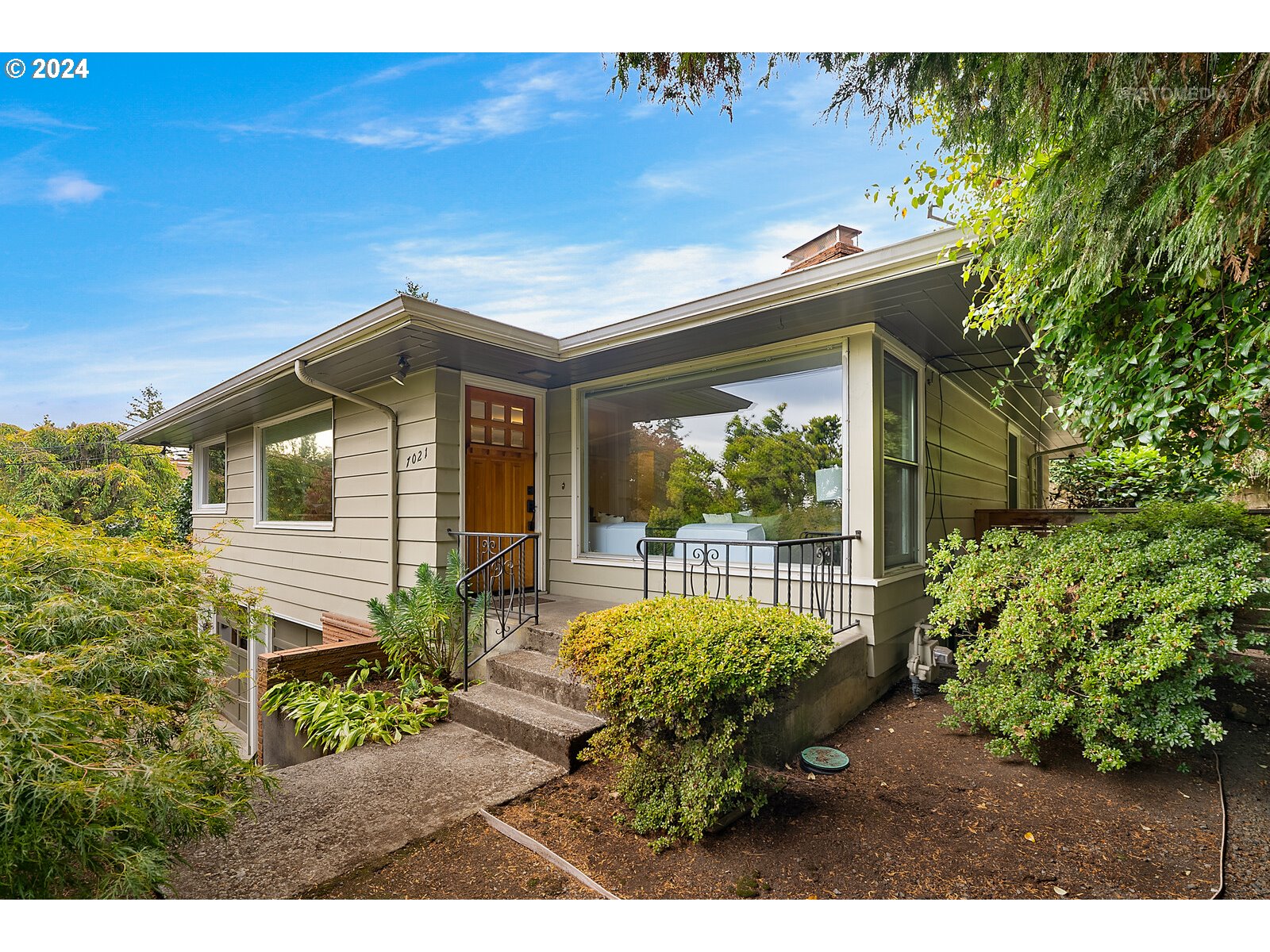 a house view with a garden space