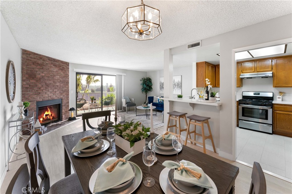 a kitchen with furniture and a fireplace