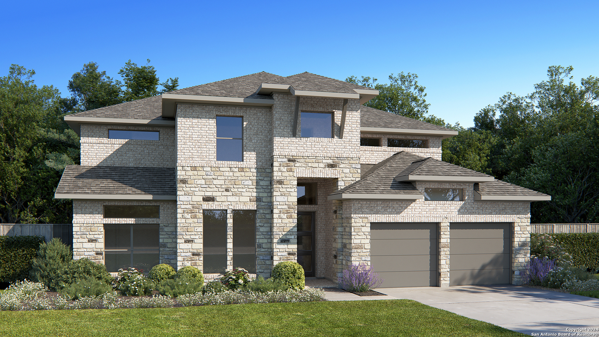 a front view of a house with a yard and garage