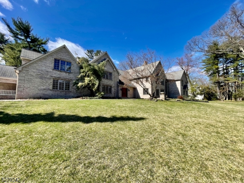 a view of house with yard