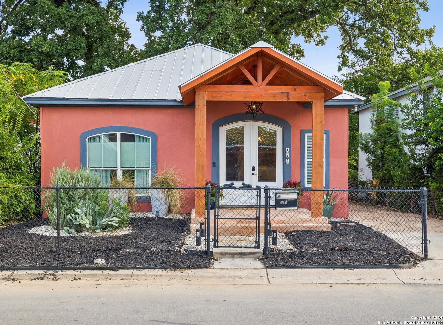 a front view of a house with garden