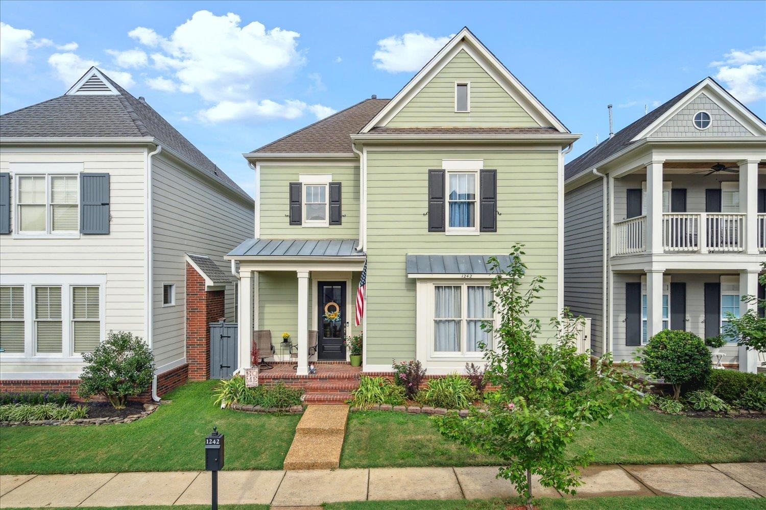 a front view of a house with garden