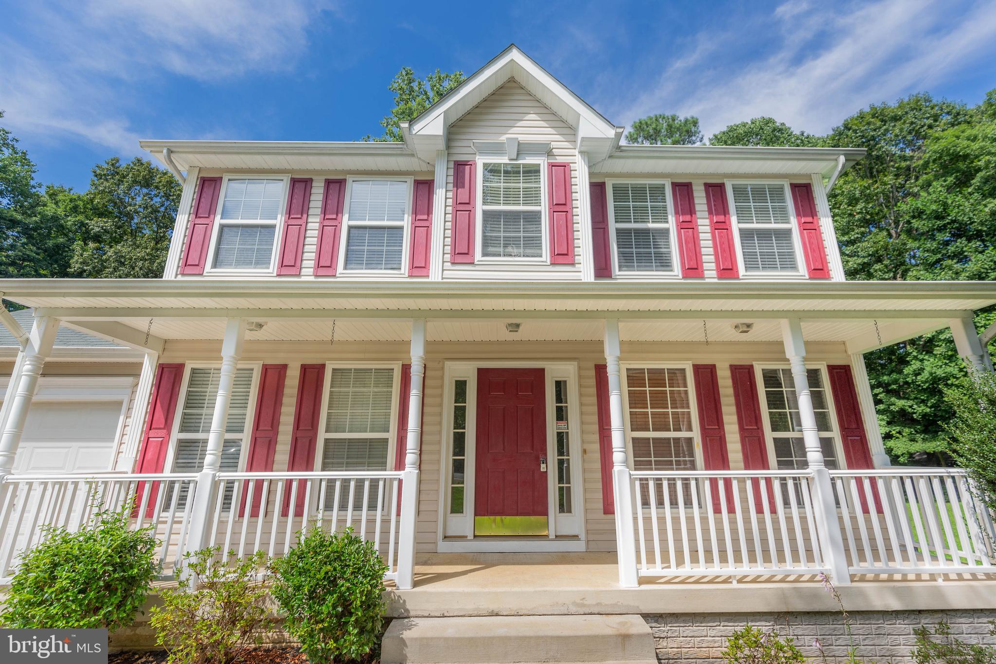 a front view of a house with a porch