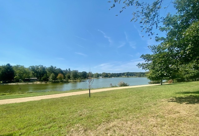 a view of a lake with a big yard