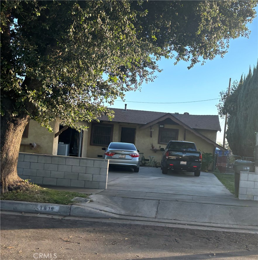 a view of a car parked front of a house