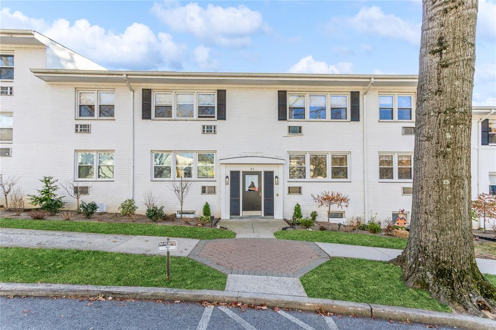 View of front of property with a front lawn