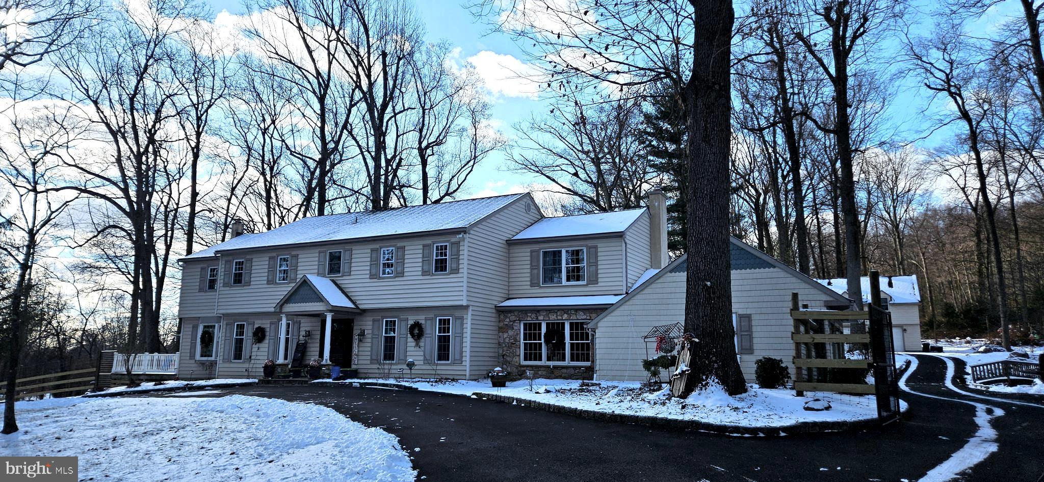 Custom Home sits on a Bucolic setting of 2.5 Acres