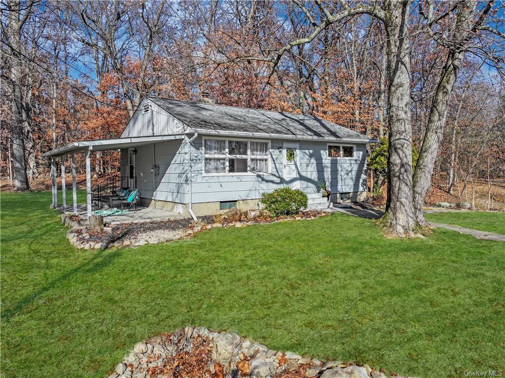 front view of a house with a yard