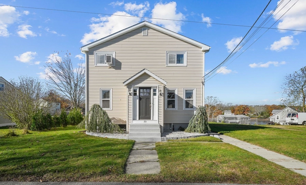 a front view of a house with a yard