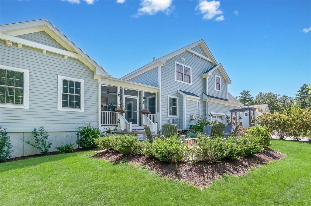 a front view of a house with a yard and porch