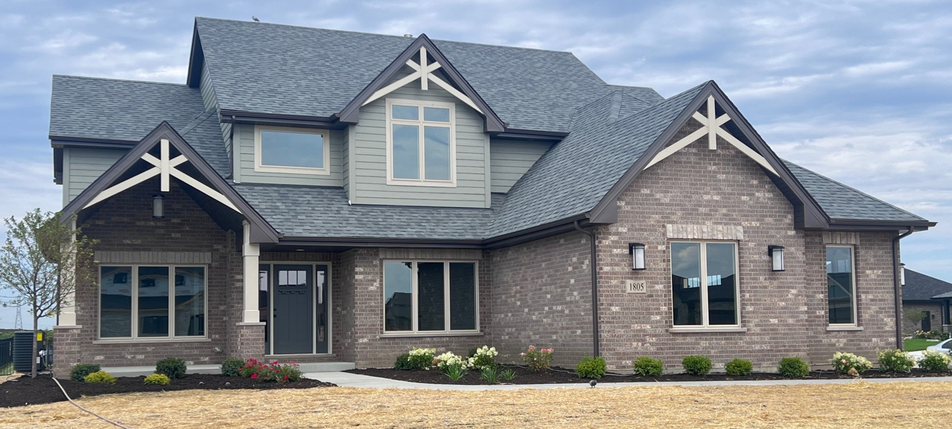 a front view of a house with a yard