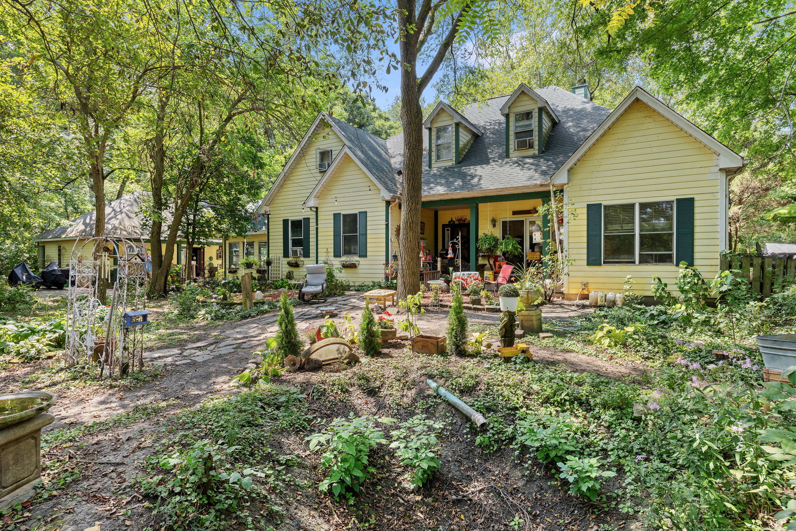 a front view of house with a garden and patio