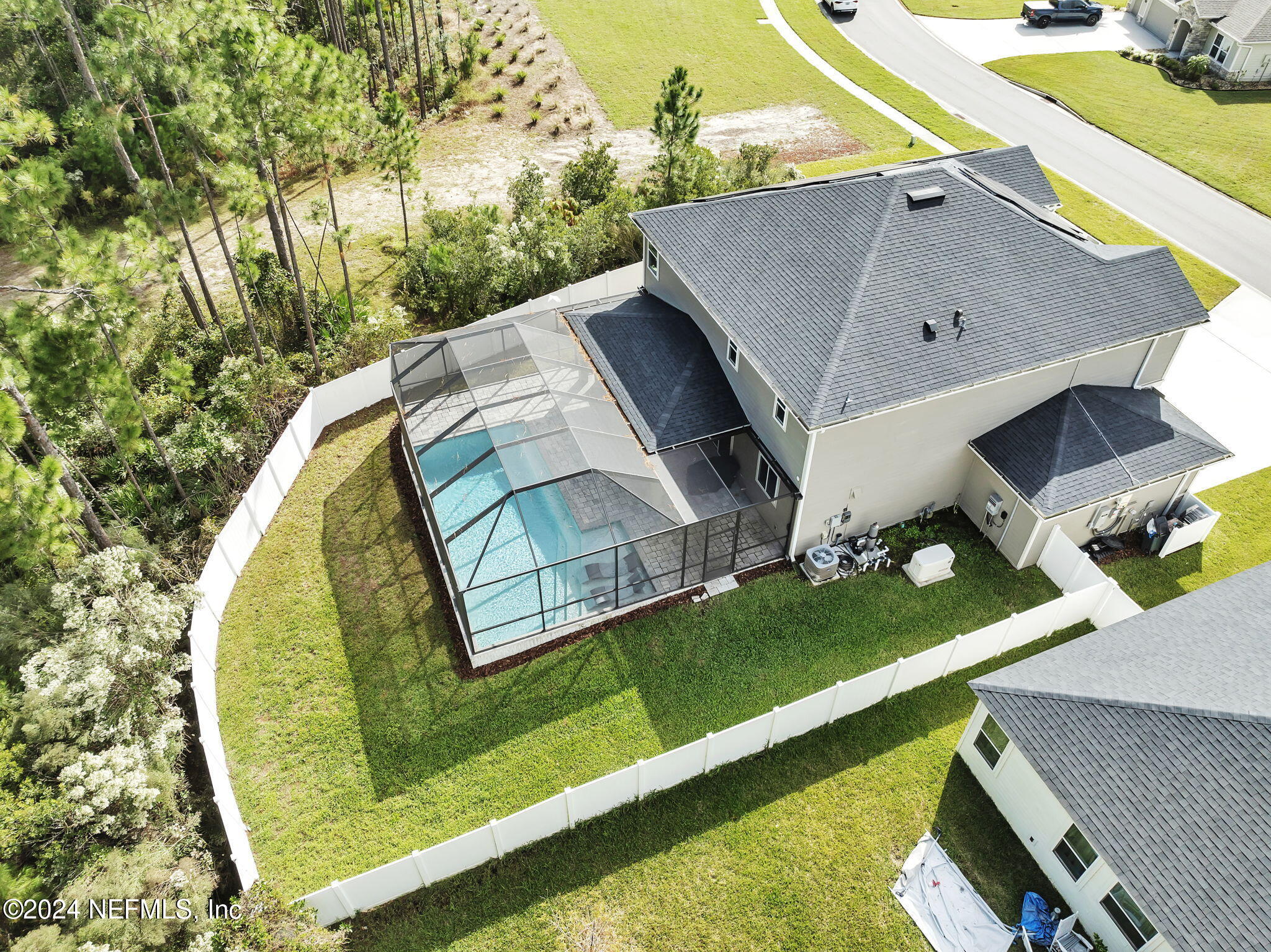 an aerial view of a house having swimming pool