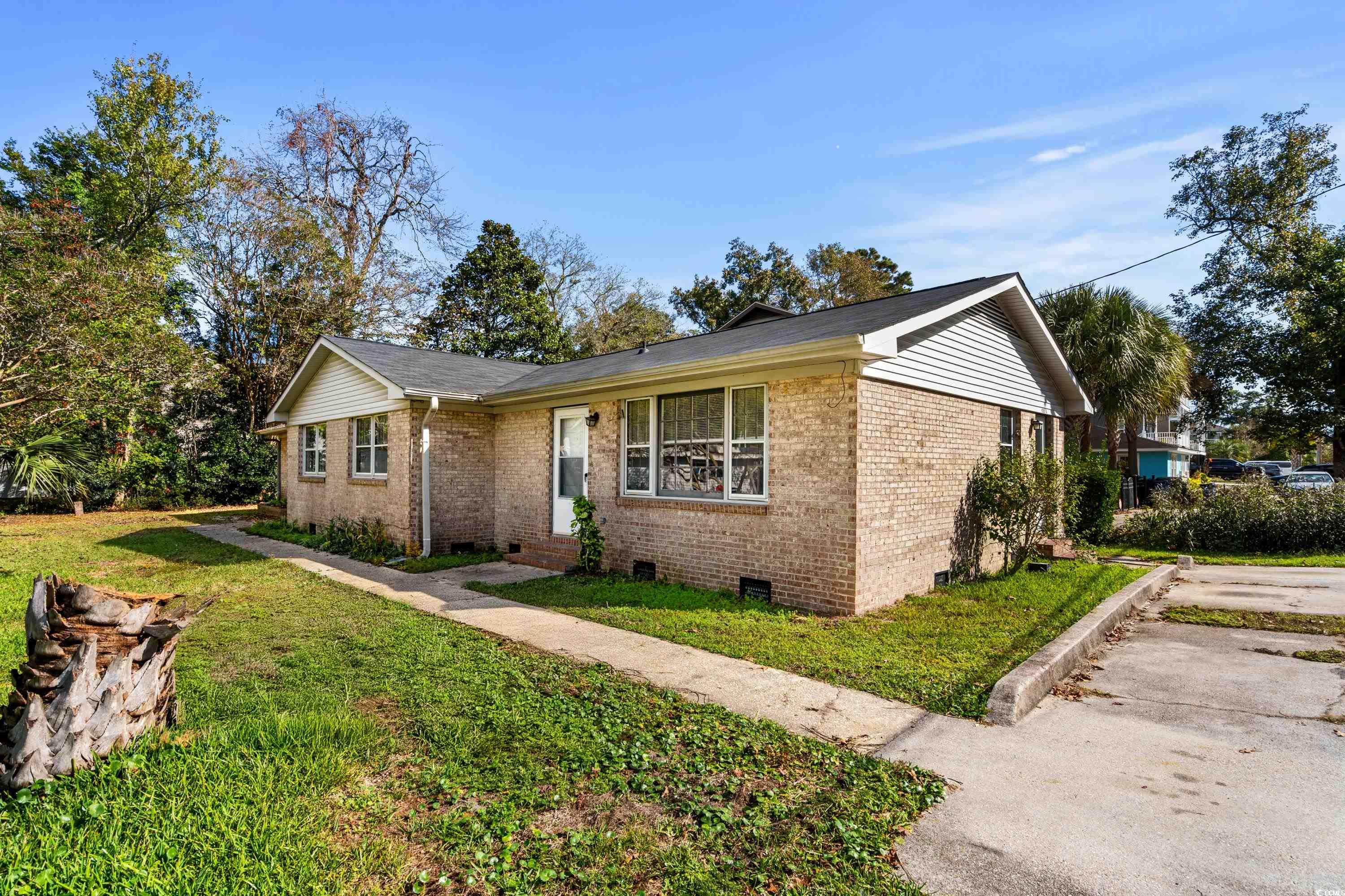 View of front of house featuring a front lawn