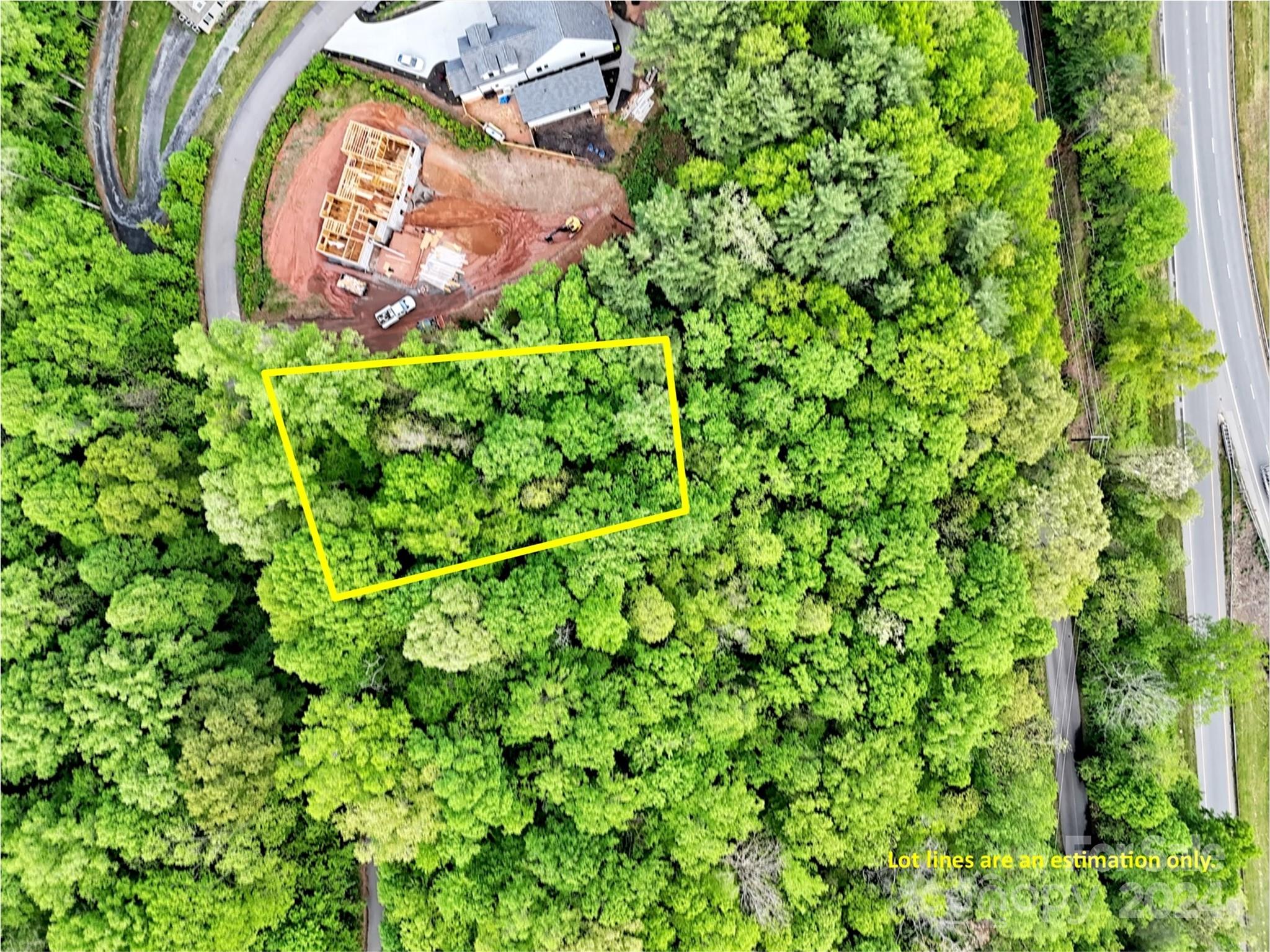 an aerial view of a house with a yard and plants