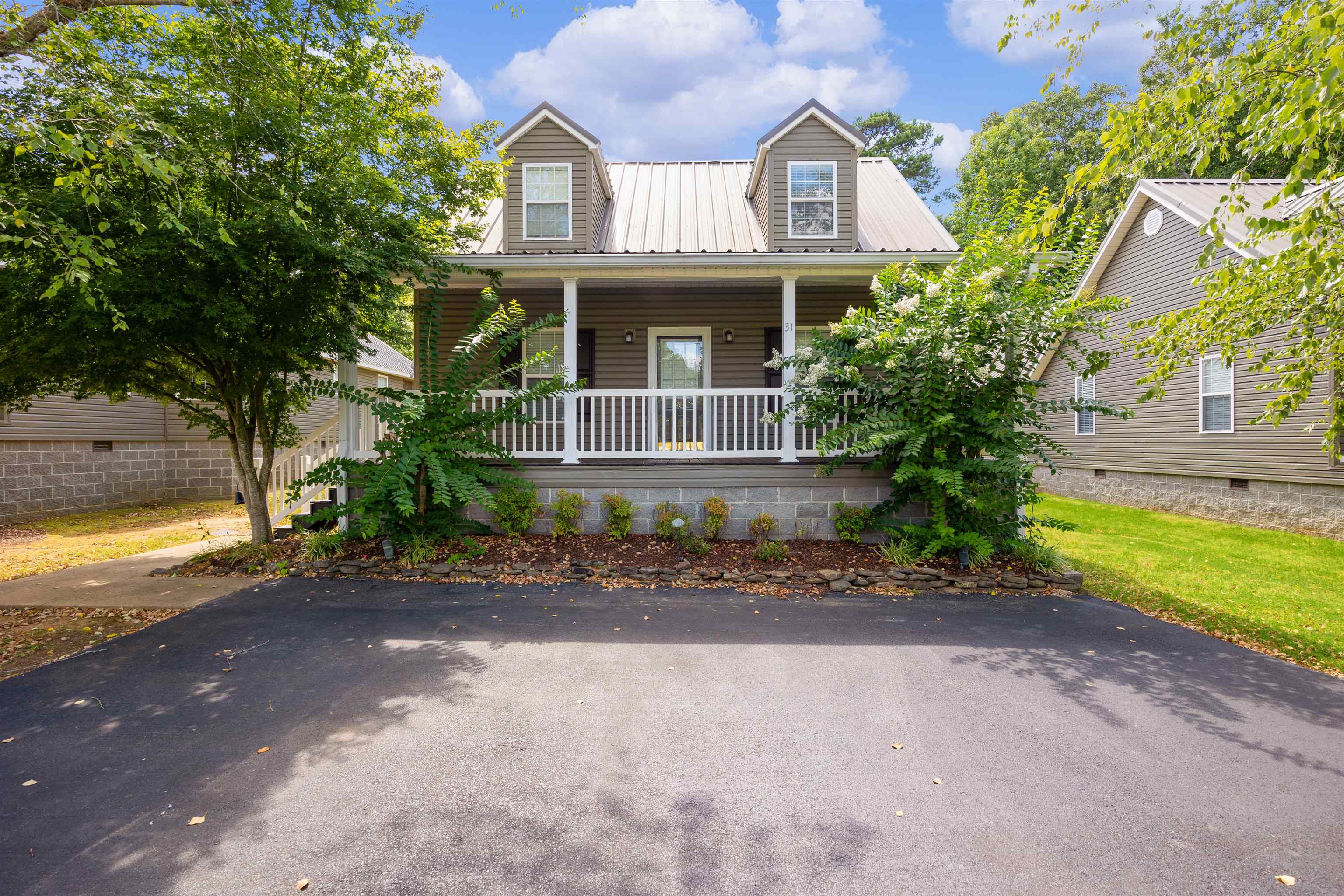 a front view of a house with garden