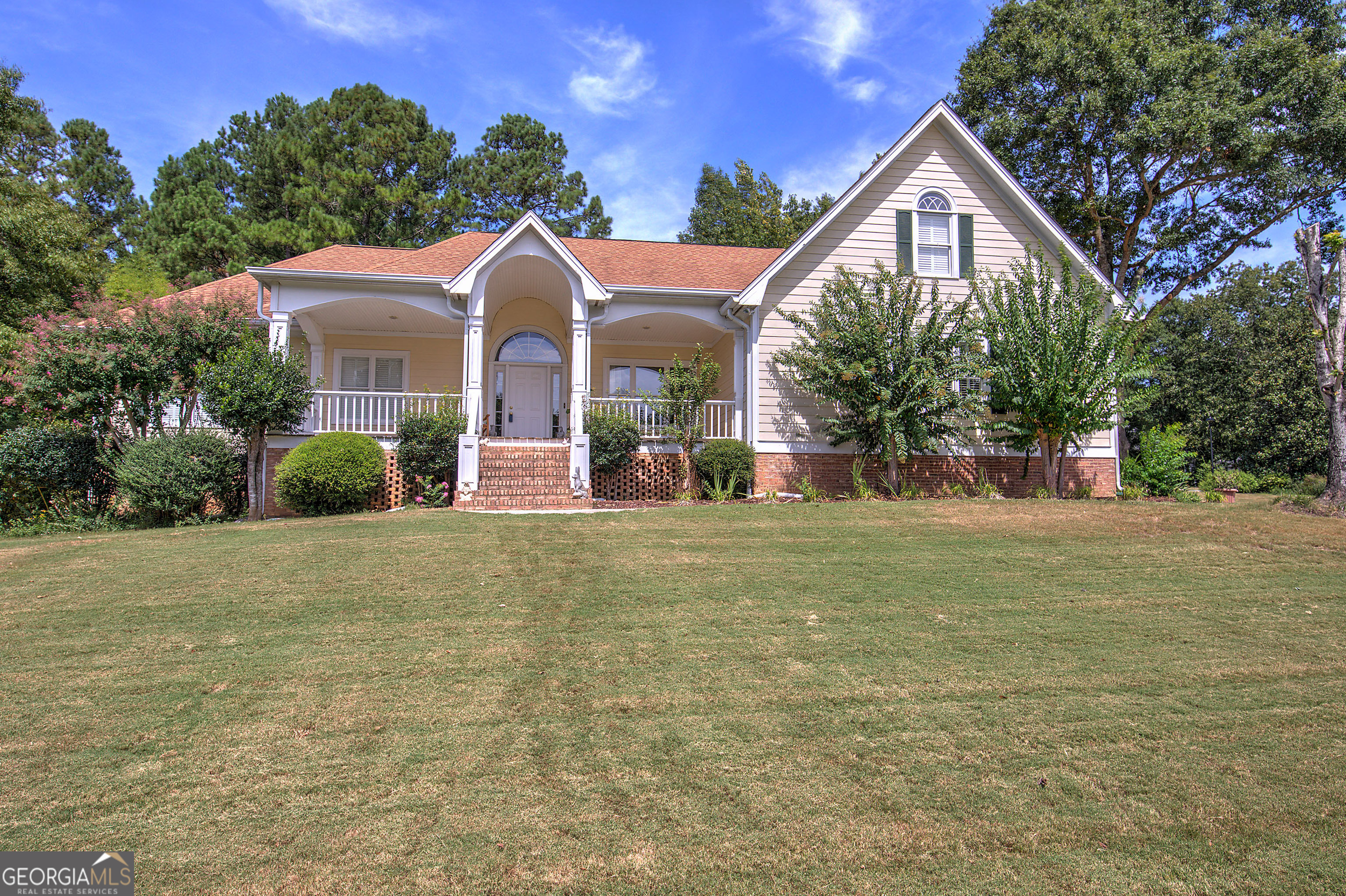 a front view of a house with a yard