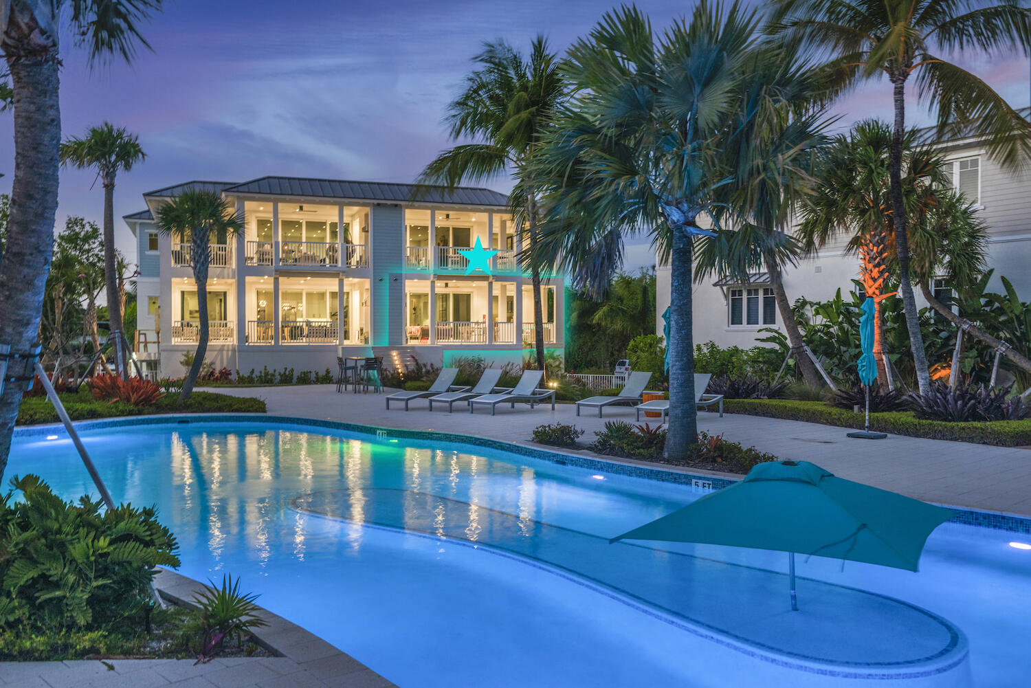 a view of swimming pool with outdoor seating and plants