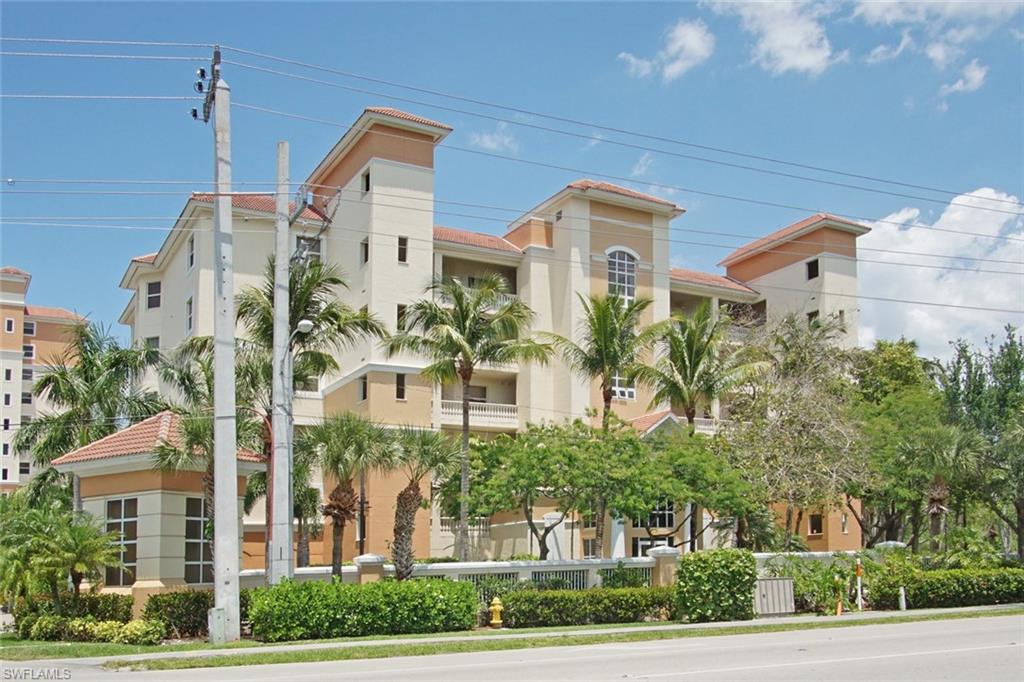 a front view of a building with a garden