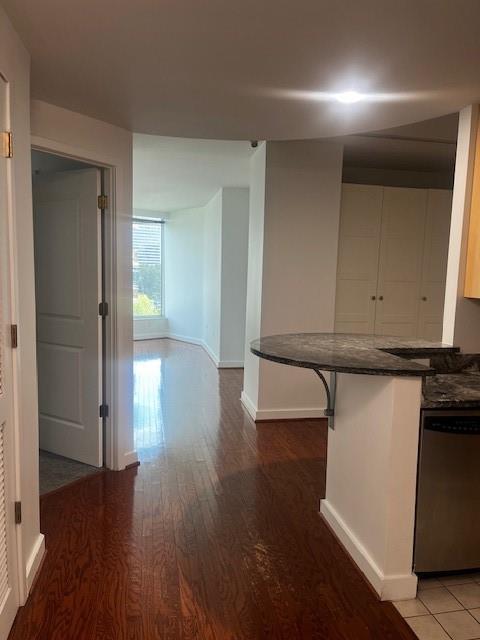 a view of hallway with wooden floor