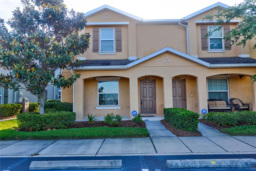 a front view of a house with yard