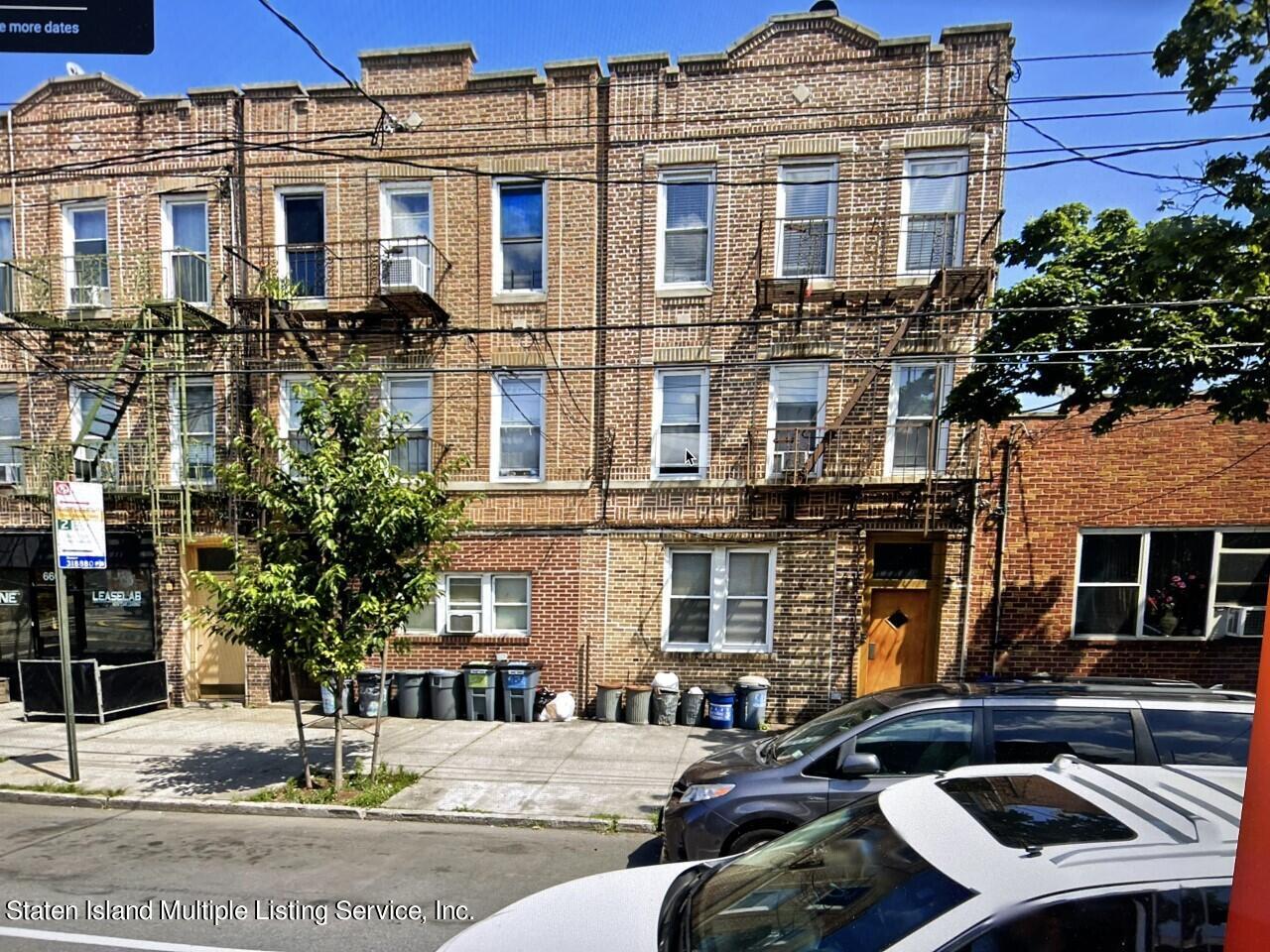 a front view of a building with street view