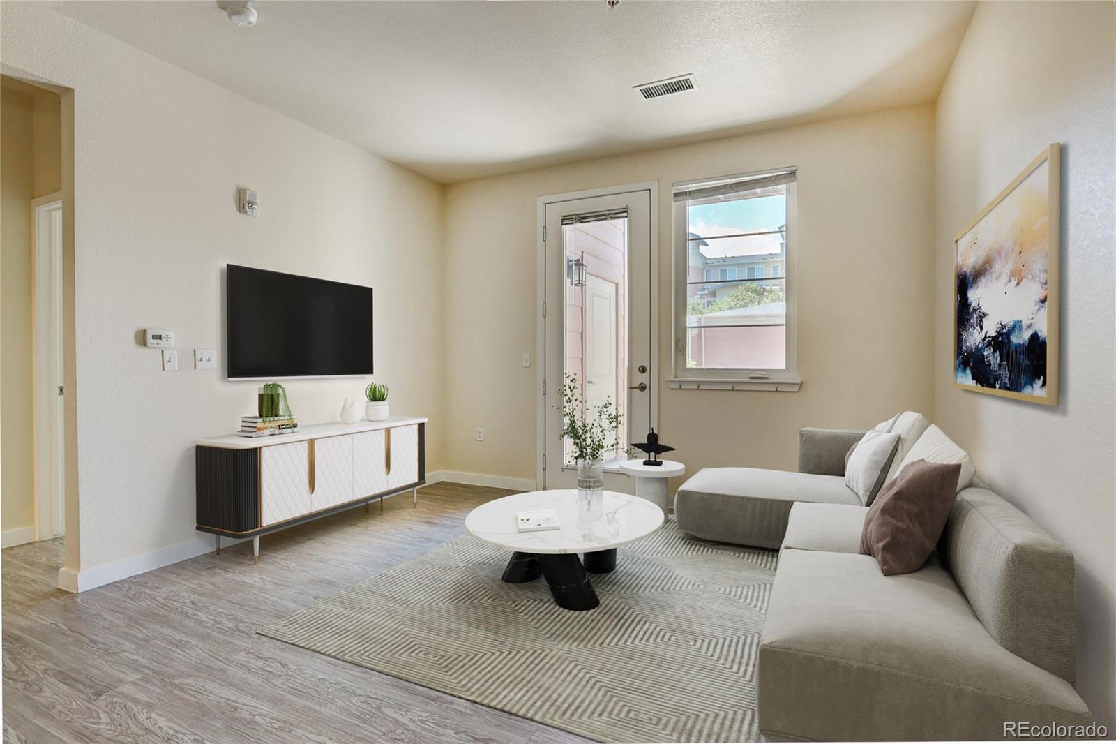 a living room with furniture and a flat screen tv