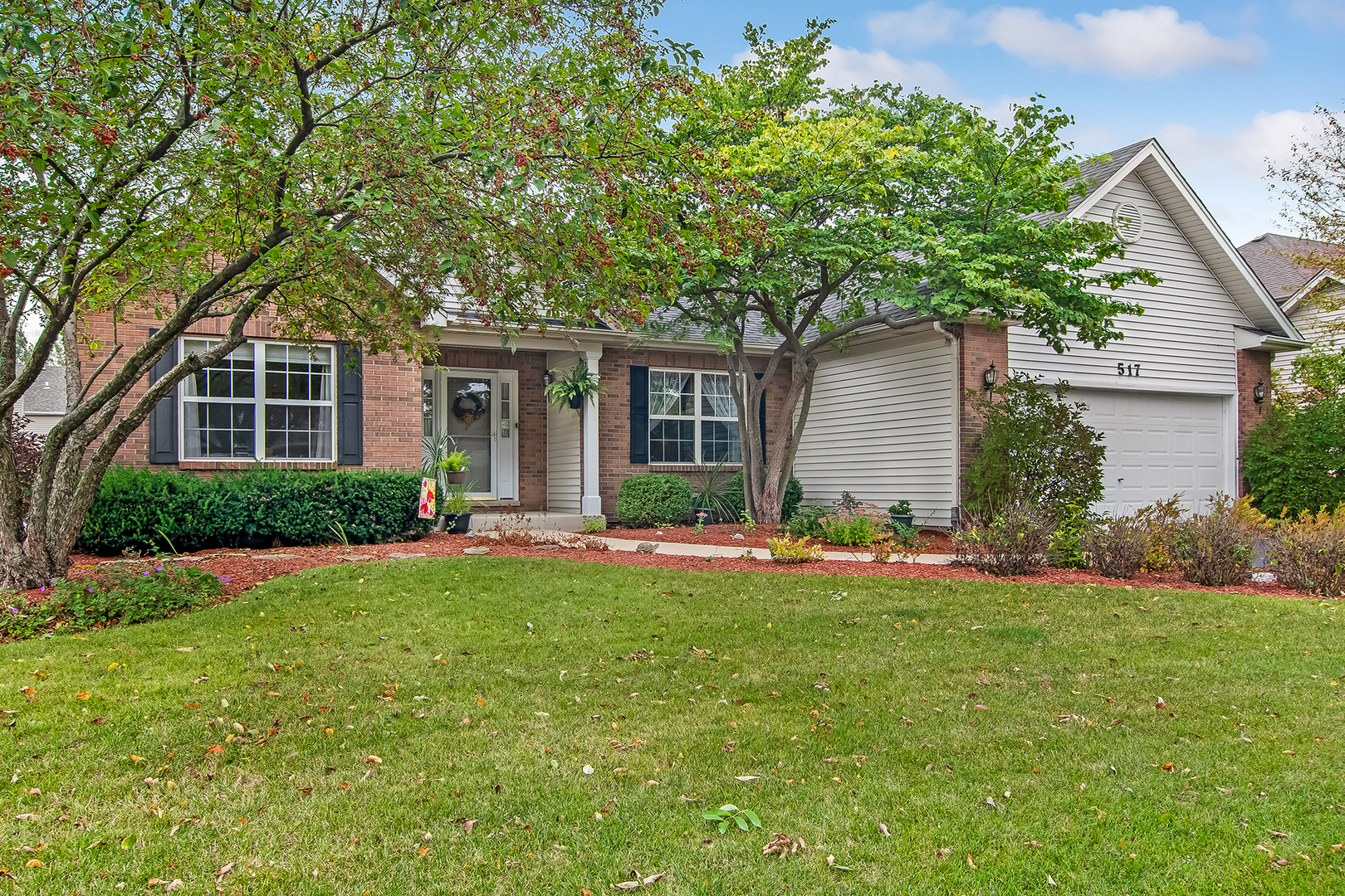 front view of a house with a yard