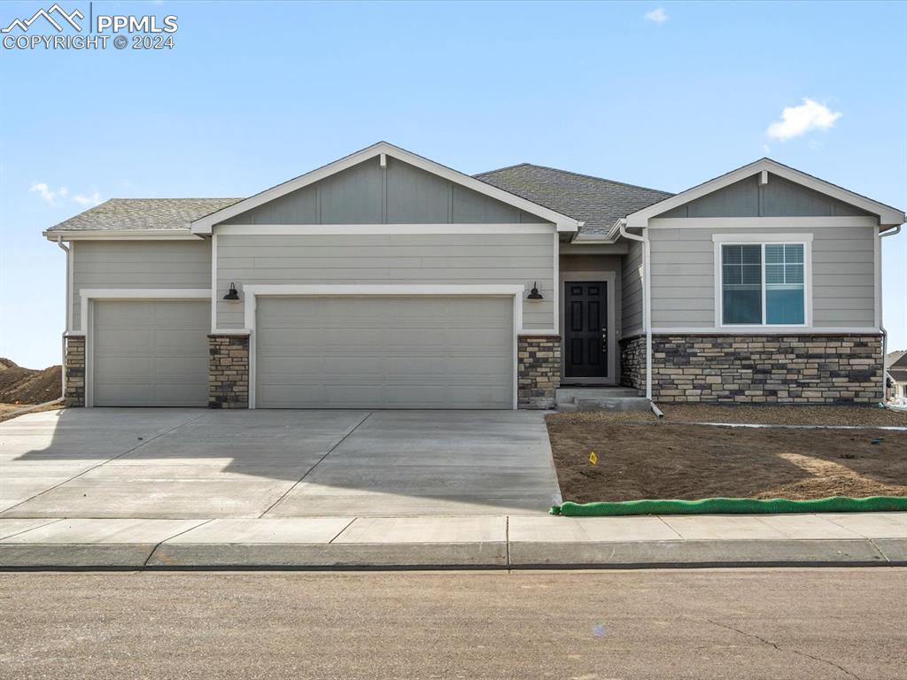 a front view of a house with garage