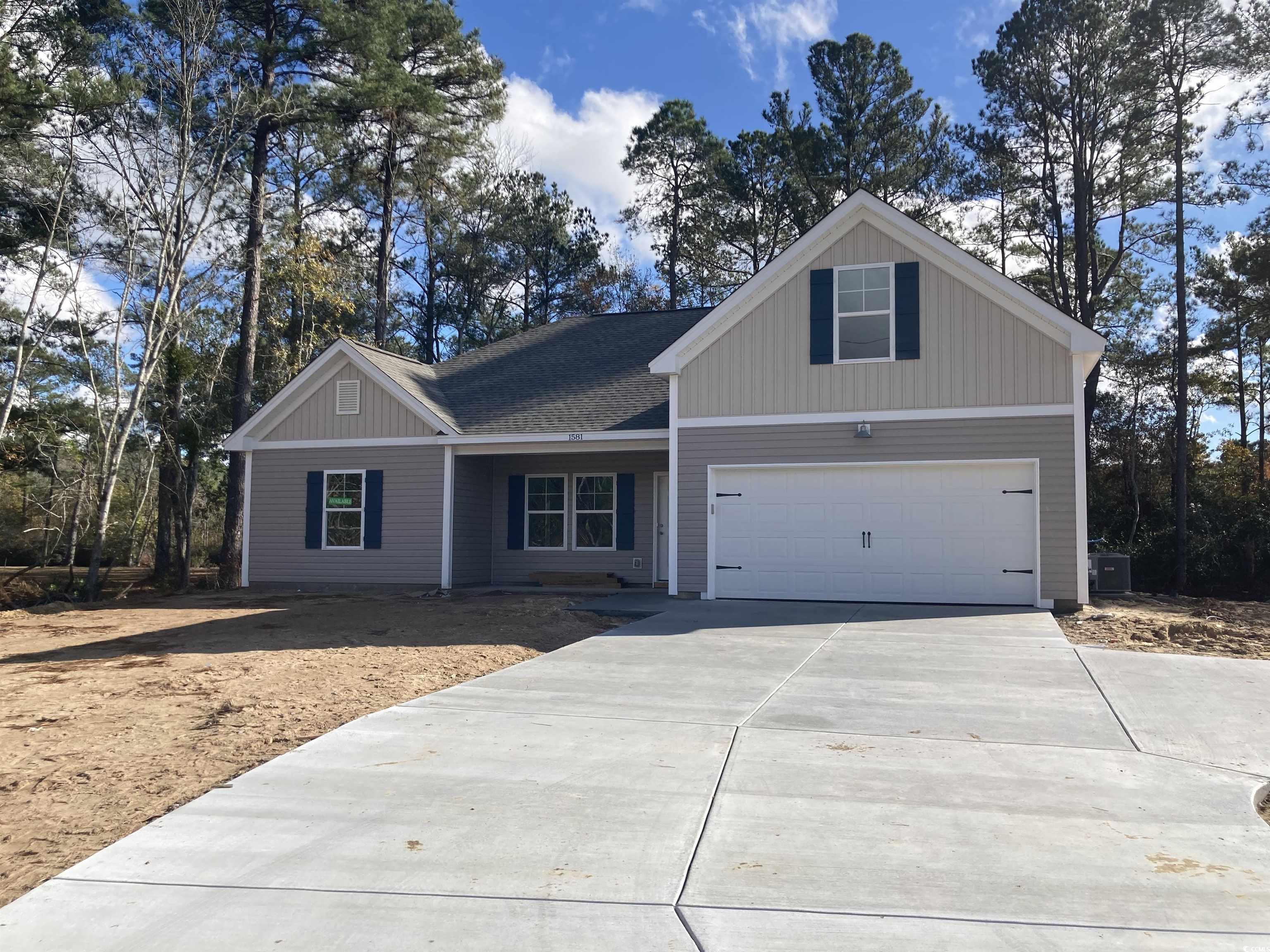 View of front of property featuring a garage