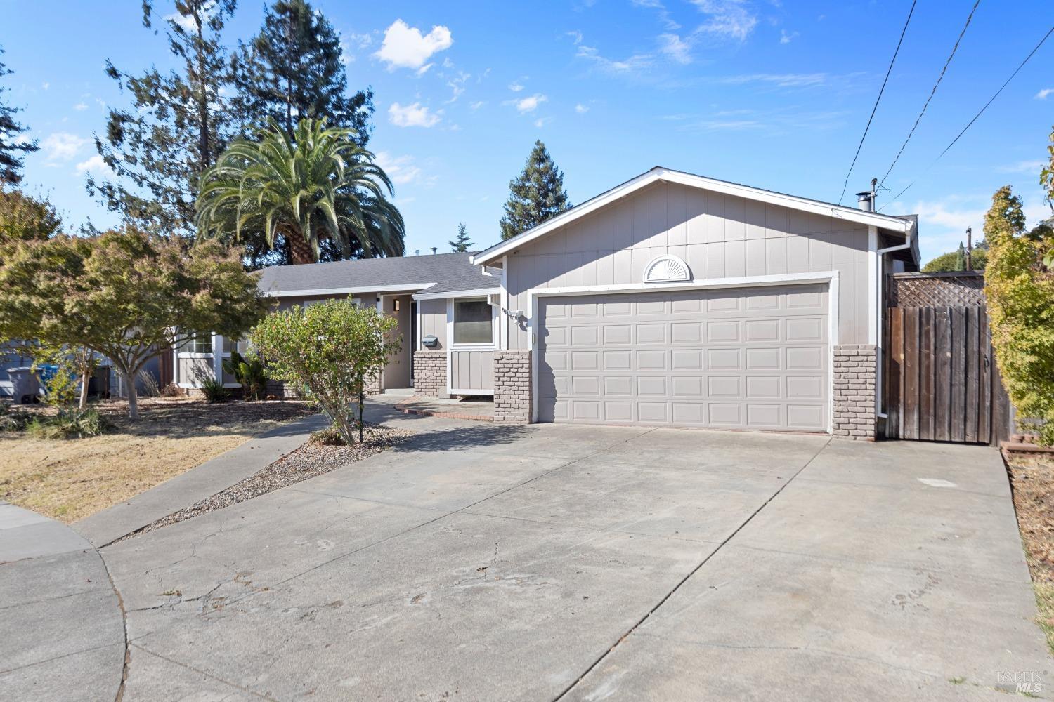 a view of a house with a yard and garage