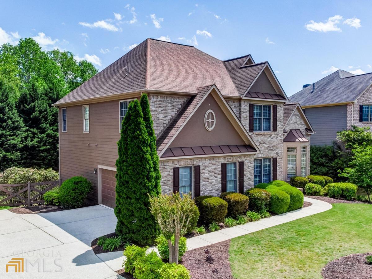 a front view of a house with a yard