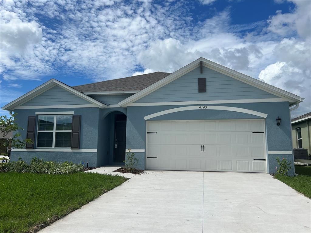 a front view of a house with garage