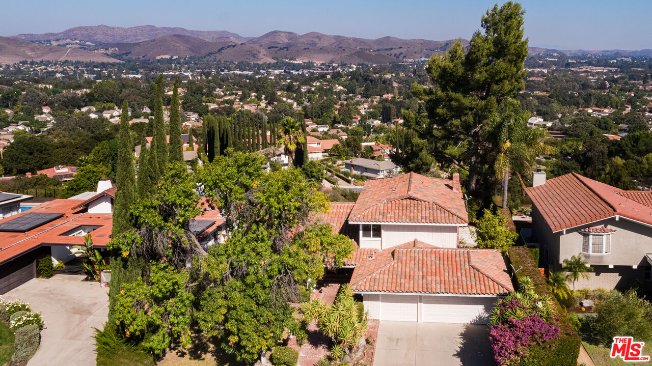 an aerial view of residential houses and trees