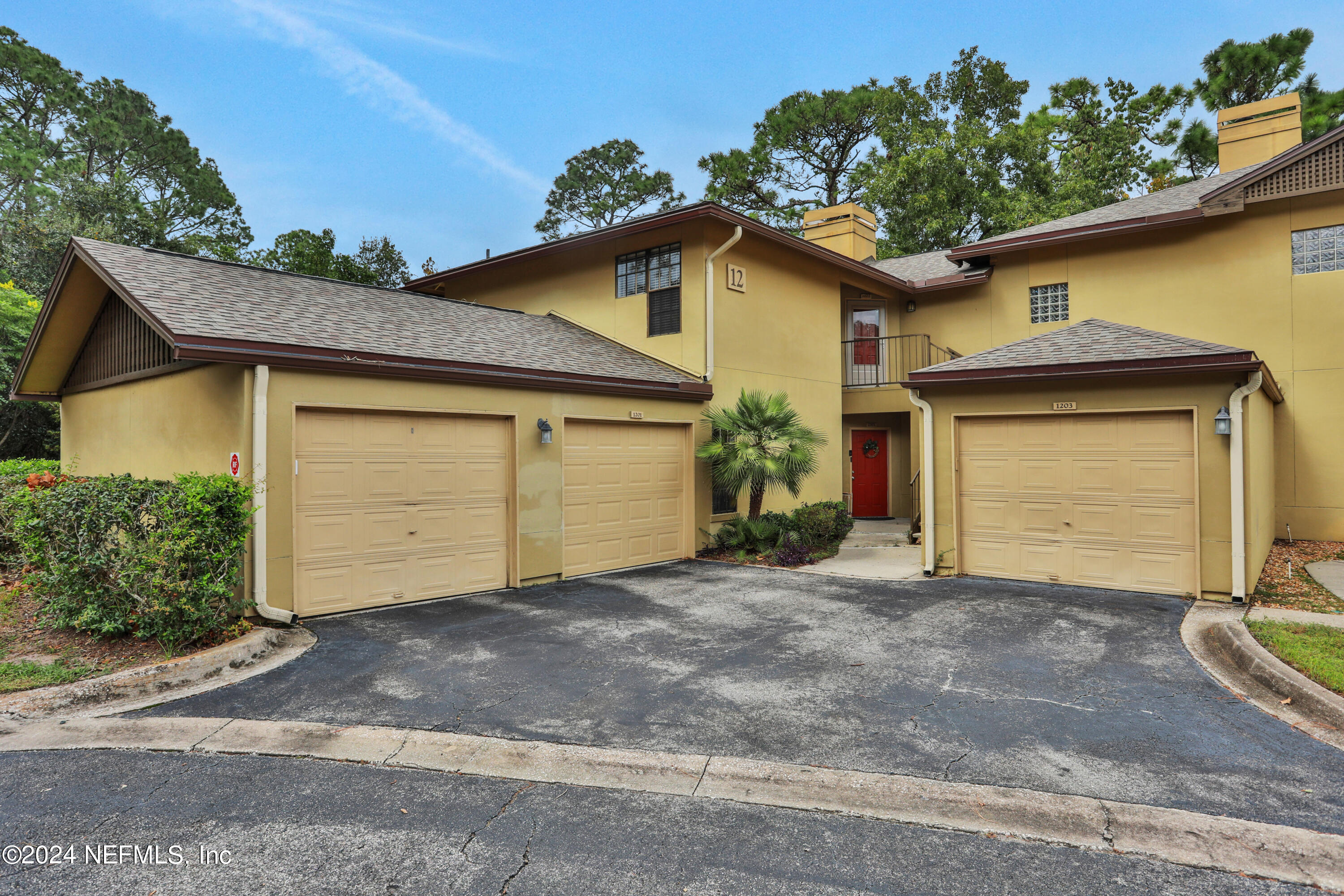 a front view of a house with a garage