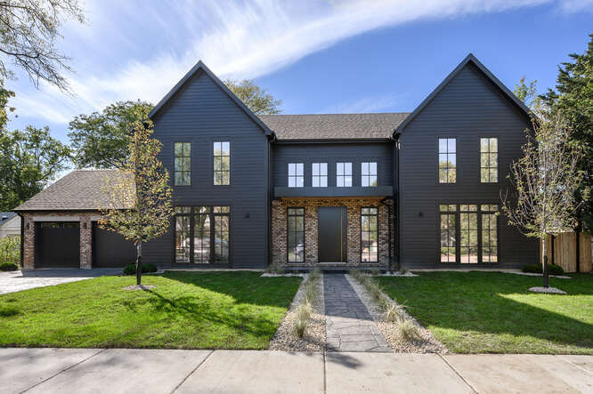 a front view of a house with a yard