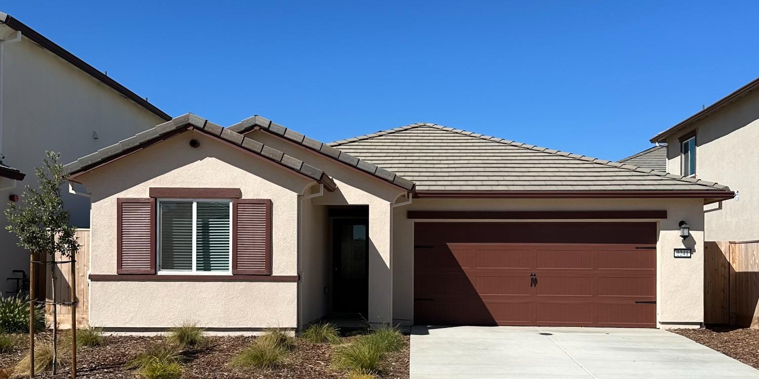 a front view of a house with a garage