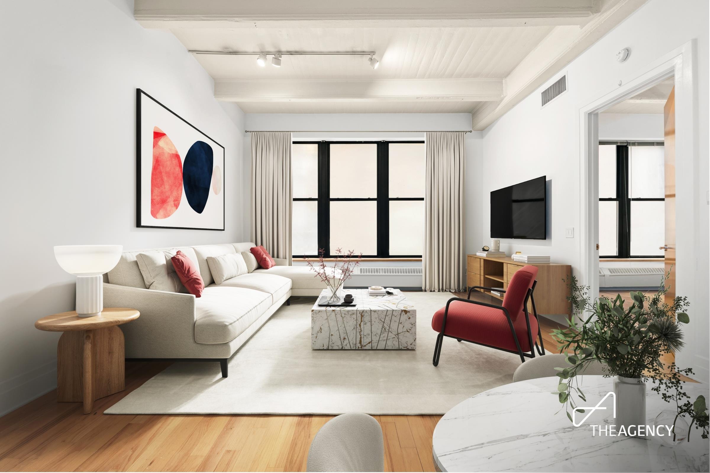 a living room with furniture and a flat screen tv