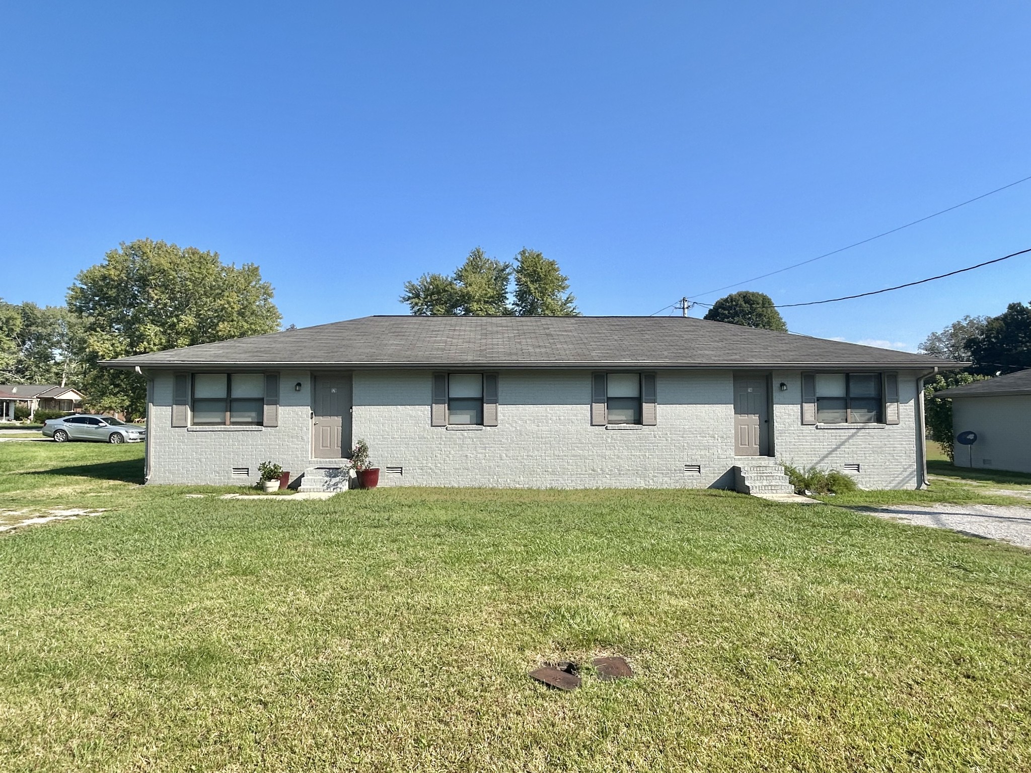 a front view of a house with a yard