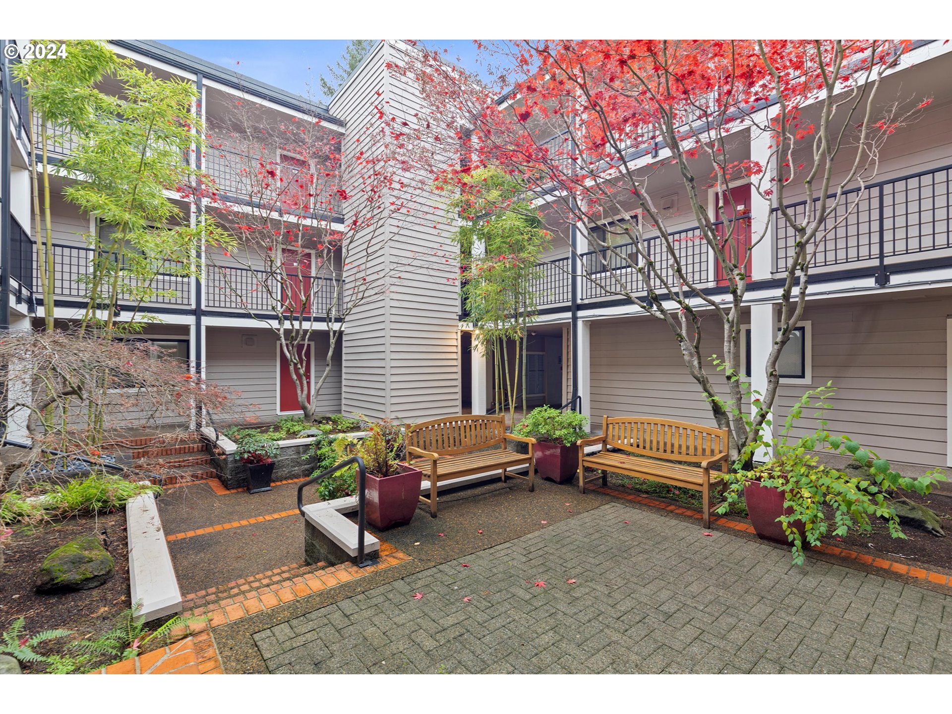 a backyard of a house with outdoor seating